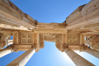 Low angle view of historical building against clear blue sky