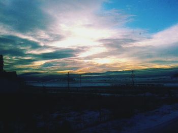 Scenic view of landscape at sunset