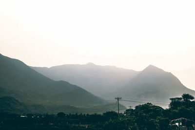 Scenic view of silhouette mountains against clear sky