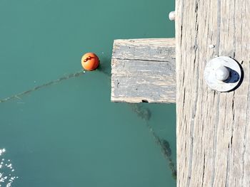 Close-up of wooden post in lake