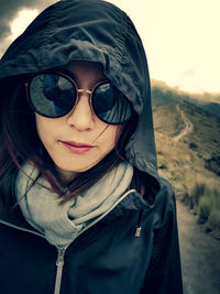 Portrait of young woman wearing sunglasses