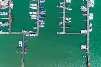 High angle view of sailboats moored in sea