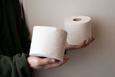 Close-up of human hand holding paper