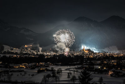 Illuminated firework at night