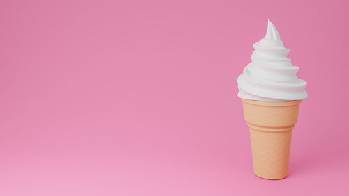 Close-up of ice cream against pink background