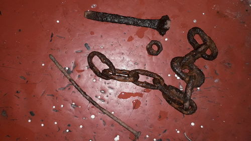 High angle view of rusty metal on wall