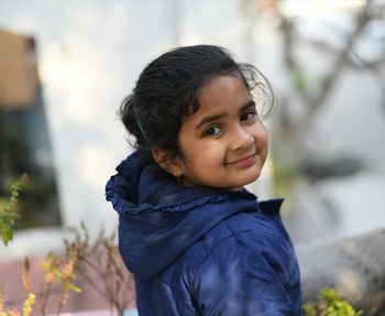 Portrait of smiling girl in winter jacket