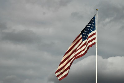 Low angle view of flag against sky