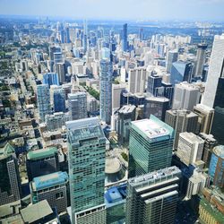 High angle view of modern buildings in city against sky