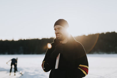 Man standing on frozen lake