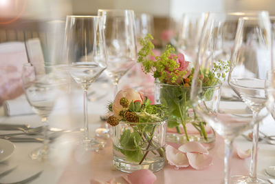 Close-up of wine glasses on table