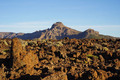 Scenic view of rocky mountains against clear sky