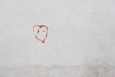 Heart shape on white wall