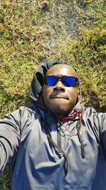 Portrait of young man wearing sunglasses