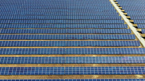 Aerial drone view flight over solar power station panels. aerial top view of solar farm. 