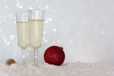 Close-up of wine and glasses on table