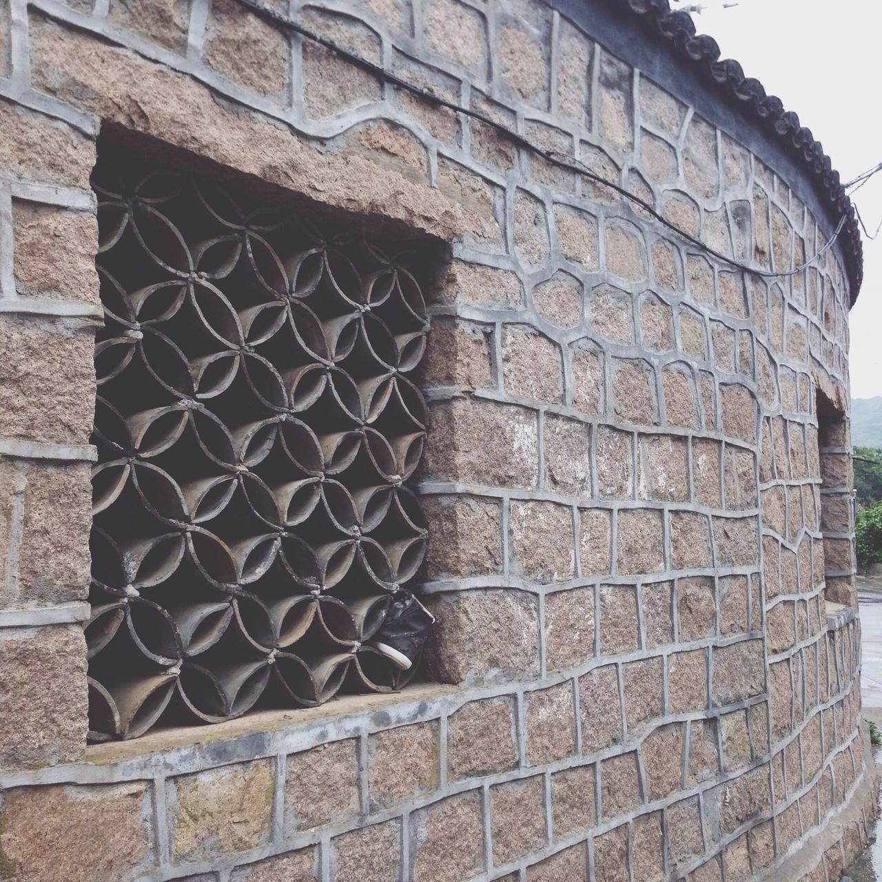 architecture, building exterior, built structure, brick wall, wall - building feature, stone wall, window, pattern, old, brick, low angle view, wall, outdoors, day, weathered, no people, building, textured, close-up, house