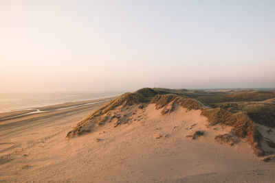 Scenic view of desert against clear sky