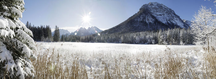 Panoramic view of snowcapped mountains against sky