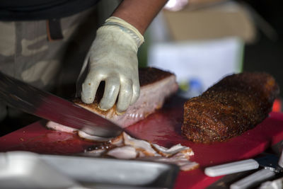 Man slicing roast beef