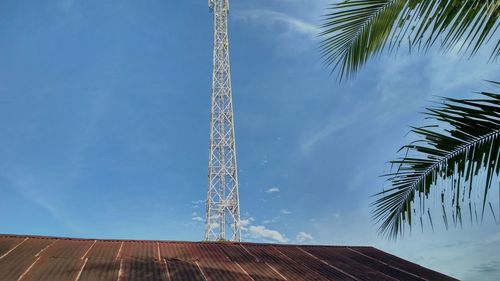 Low angle view of metal structure against blue sky