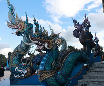 Low angle view of statue against sky