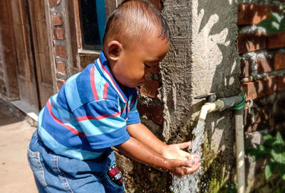 Side view of boy in water