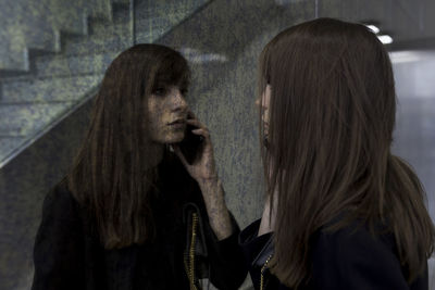Portrait of woman standing at home