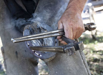 Cropped image of man welding metal