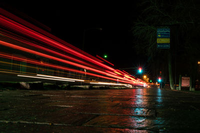 Illuminated bridge in city at night