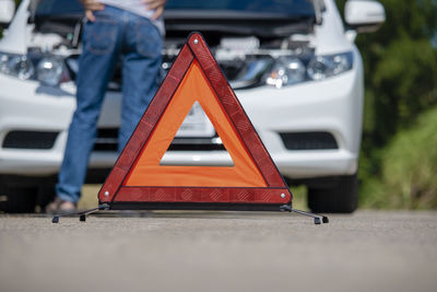 Close-up of red car on road