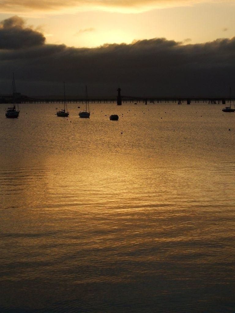 sunset, water, sea, sky, scenics, tranquil scene, tranquility, beauty in nature, orange color, silhouette, waterfront, cloud - sky, idyllic, nature, nautical vessel, rippled, boat, reflection, cloud, transportation