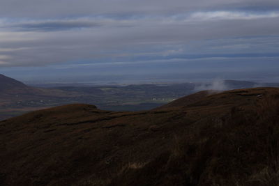 View of landscape against cloudy sky