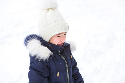 Portrait of cute girl in snow