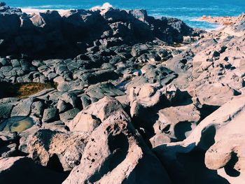 High angle view of rock formations in sea