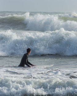 Man surfing in sea