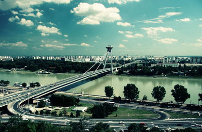 High angle view of highway by street against sky