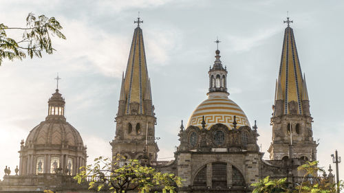 View of cathedral and buildings against sky