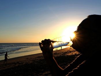 Scenic view of sea at sunset