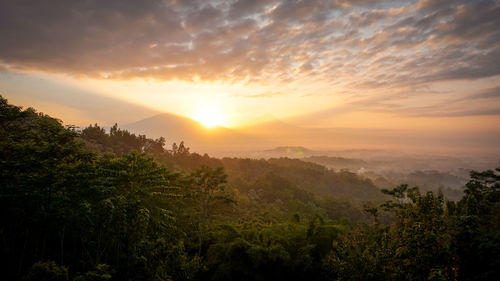 Scenic view of landscape against sky during sunset