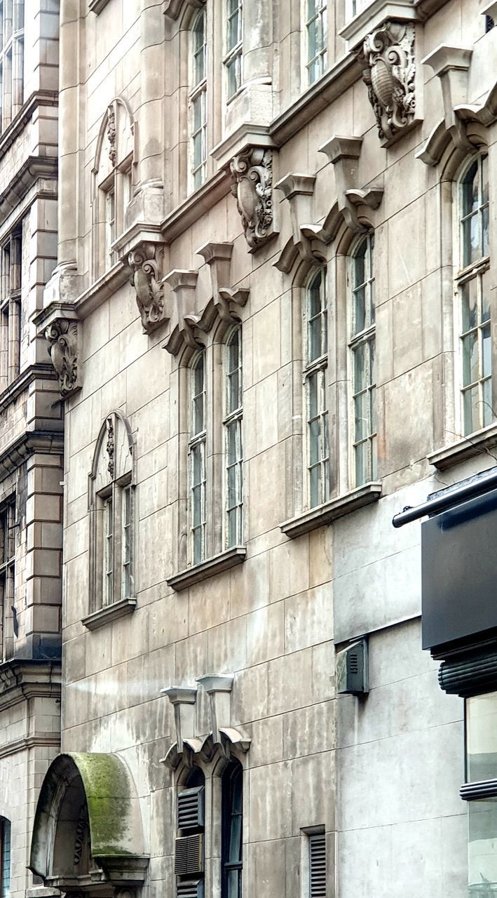 LOW ANGLE VIEW OF RESIDENTIAL BUILDING