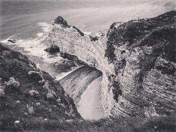 Scenic view of sea and mountain against sky