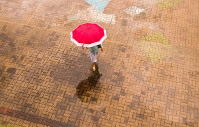 High angle view of woman with umbrella