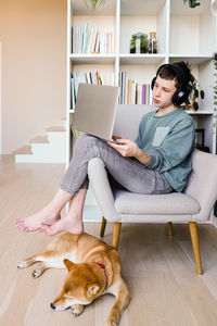 Portrait of young woman with dog