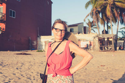 Retired woman enjoying the sunset at the beach in mexico