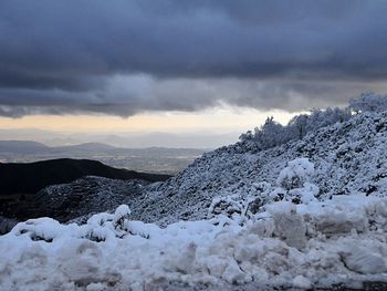 Scenic view of mountains against sky during winter