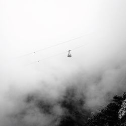 Low angle view of foggy weather