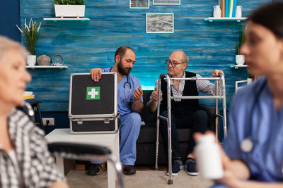 Group of people sitting on table