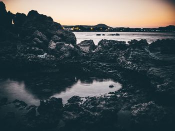 Scenic view of sea against sky during sunset