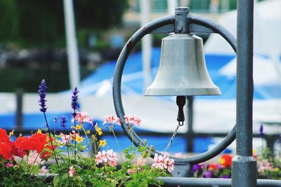 Close-up of bell hanging outdoors